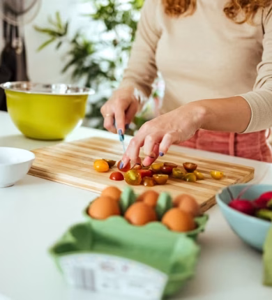 Woman preparing a balanced meal in a bright kitchen